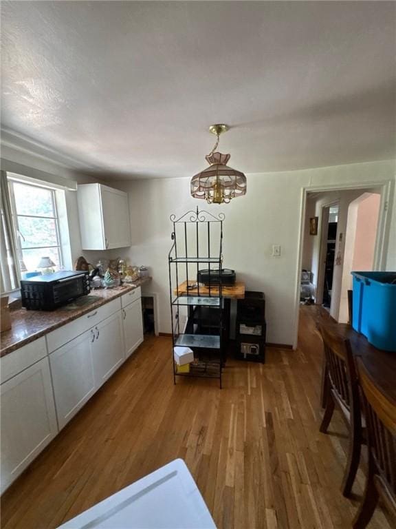 155 Roosevelt Ave, Stowe Twp, PA 15136 - dining area featuring light wood-style floors and a chandelier