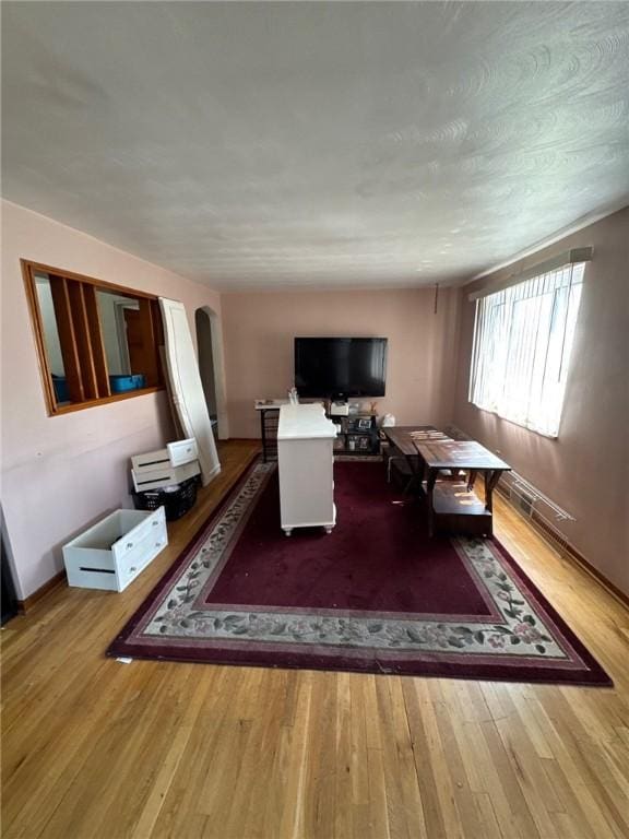 155 Roosevelt Ave, Stowe Twp, PA 15136 - living area featuring wood finished floors and arched walkways