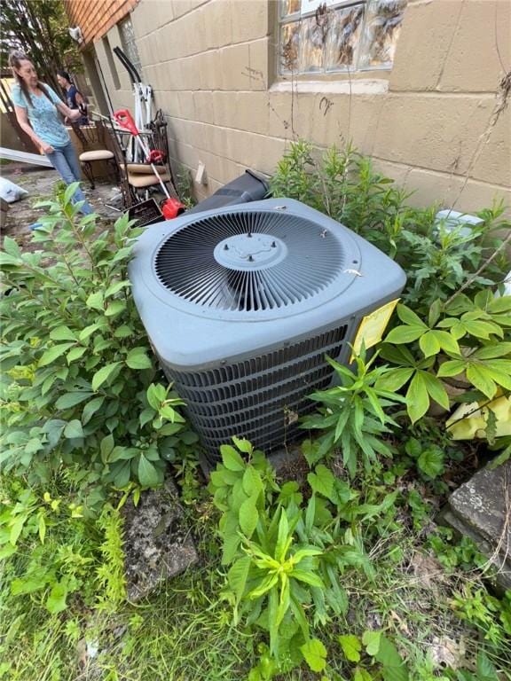 155 Roosevelt Ave, Stowe Twp, PA 15136 - exterior view of a cooling unit and concrete block siding