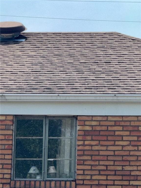 155 Roosevelt Ave, Stowe Twp, PA 15136 - exterior view of a shingled roof, brick siding, and gutters