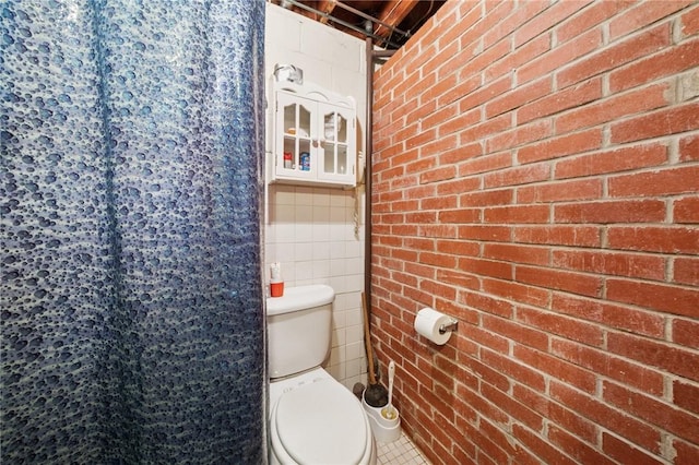 161 Thorne Dr N, Franklin Twp, PA 15301 - bathroom with tile walls, curtained shower, and brick wall