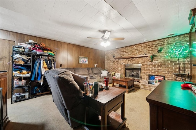 161 Thorne Dr N, Franklin Twp, PA 15301 - carpeted living area with ceiling fan, wood walls, a fireplace, and brick wall