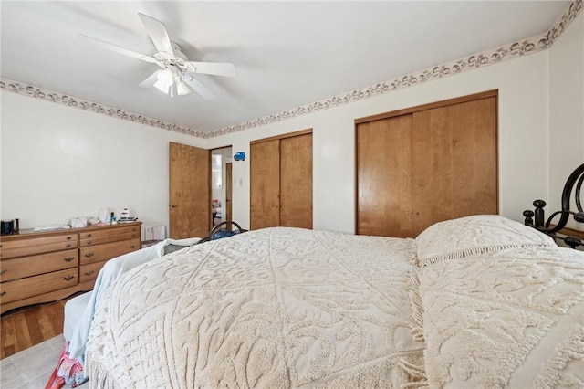 161 Thorne Dr N, Franklin Twp, PA 15301 - bedroom featuring multiple closets, wood finished floors, and ceiling fan