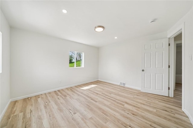 1460 Guffey Rd, North Huntingdon, PA 15642 - empty room featuring light wood finished floors, recessed lighting, and a smoke detector