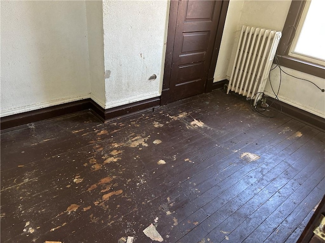3134-3136 Huxley St, Sheraden, PA 15204 - unfurnished room featuring radiator heating unit and dark wood-style flooring