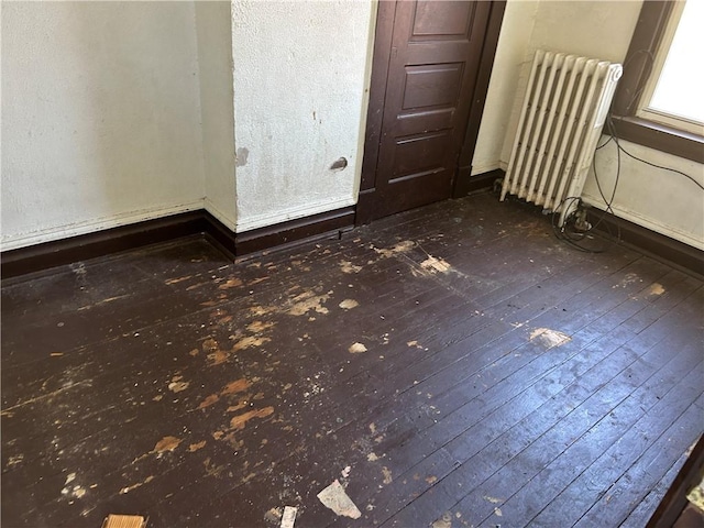 3134-3136 Huxley St, Sheraden, PA 15204 - empty room with radiator and dark wood finished floors