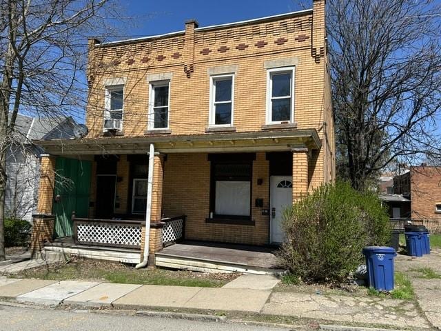 3134-3136 Huxley St, Sheraden, PA 15204 - view of front facade featuring covered porch and brick siding