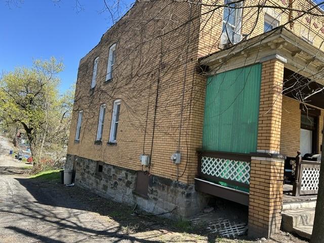 3134-3136 Huxley St, Sheraden, PA 15204 - view of property exterior with brick siding