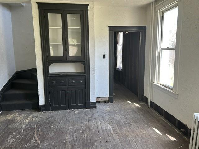 3134-3136 Huxley St, Sheraden, PA 15204 - interior space with hardwood / wood-style floors, a textured wall, and radiator