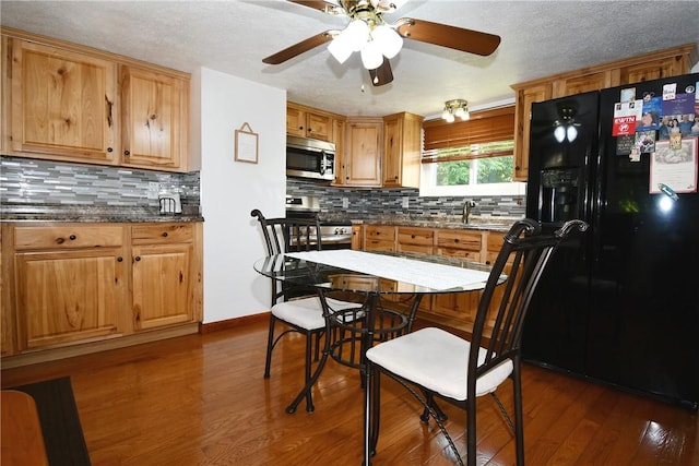 226 Johnston St, Cecil, PA 15057 - kitchen featuring appliances with stainless steel finishes, ceiling fan, dark wood-style floors, backsplash, and a textured ceiling