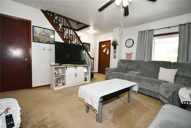 226 Johnston St, Cecil, PA 15057 - living area featuring stairs, light carpet, and ceiling fan
