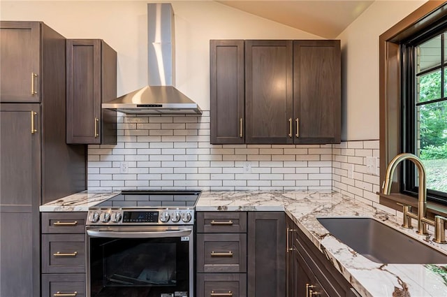 5 Bel Aire Dr, Murrysville, PA 15626 - kitchen with wall chimney range hood, stainless steel electric range, lofted ceiling, decorative backsplash, and light stone counters