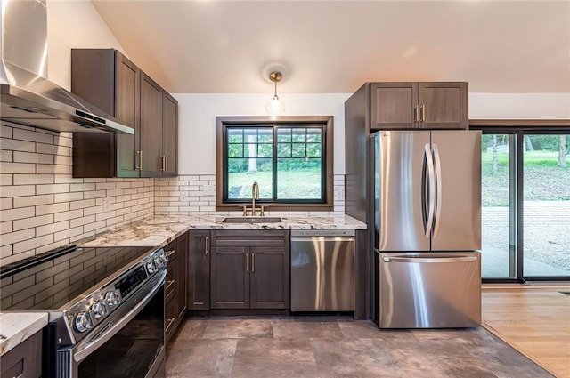 5 Bel Aire Dr, Murrysville, PA 15626 - kitchen with stainless steel appliances, wall chimney exhaust hood, light stone countertops, dark brown cabinets, and healthy amount of natural light
