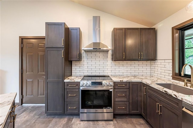 5 Bel Aire Dr, Murrysville, PA 15626 - kitchen with stainless steel appliances, wall chimney range hood, lofted ceiling, backsplash, and light stone counters