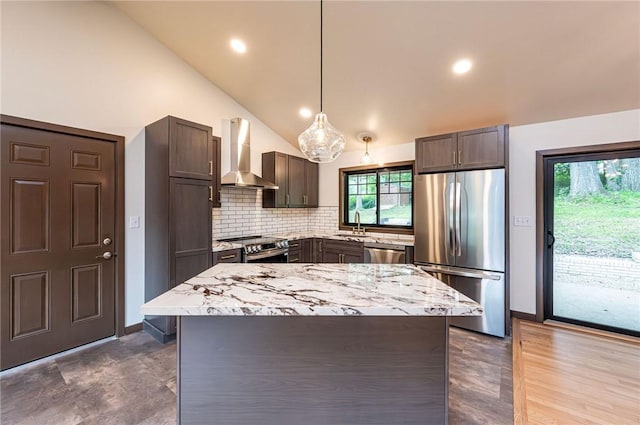 5 Bel Aire Dr, Murrysville, PA 15626 - kitchen featuring stainless steel appliances, wall chimney range hood, lofted ceiling, decorative backsplash, and light stone countertops