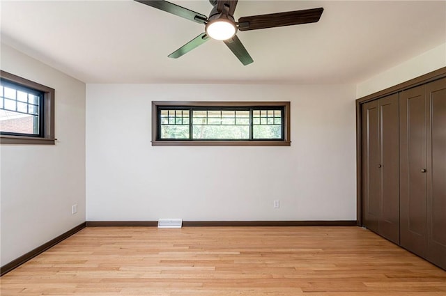 5 Bel Aire Dr, Murrysville, PA 15626 - unfurnished bedroom with multiple windows, light wood-type flooring, and a closet
