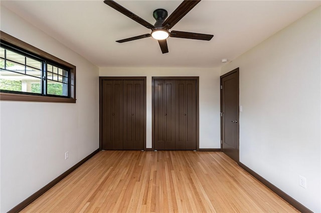 5 Bel Aire Dr, Murrysville, PA 15626 - unfurnished bedroom featuring light wood-type flooring, multiple closets, and ceiling fan