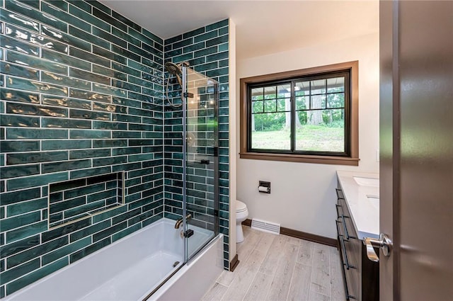 5 Bel Aire Dr, Murrysville, PA 15626 - full bathroom featuring vanity, wood finished floors, and enclosed tub / shower combo