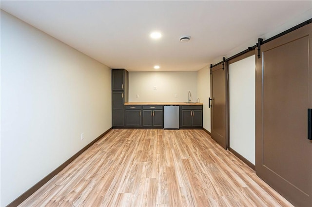 5 Bel Aire Dr, Murrysville, PA 15626 - indoor wet bar featuring refrigerator, light wood-type flooring, a barn door, and recessed lighting
