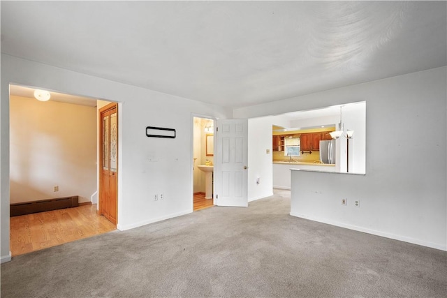 1810 Fairland St, Carrick, PA 15210 - unfurnished living room featuring light carpet and baseboards
