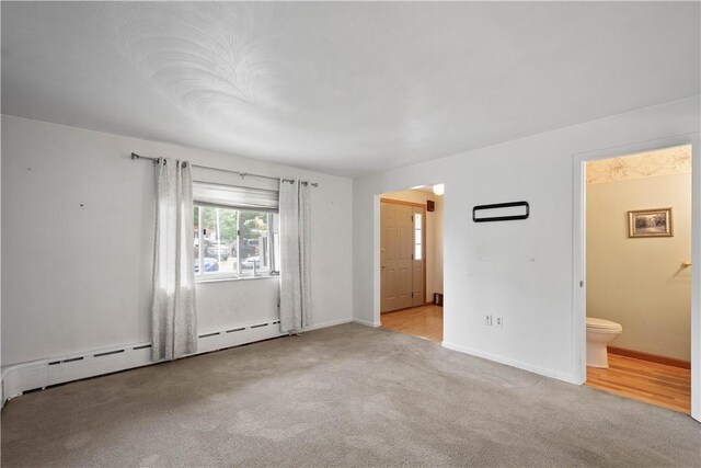 1810 Fairland St, Carrick, PA 15210 - unfurnished bedroom with carpet, a baseboard radiator, and connected bathroom