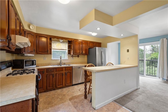1810 Fairland St, Carrick, PA 15210 - kitchen featuring stainless steel appliances, under cabinet range hood, light countertops, a breakfast bar, and open shelves