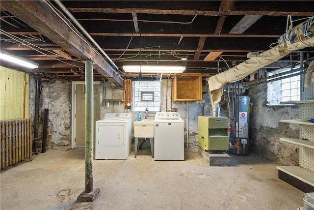 1810 Fairland St, Carrick, PA 15210 - below grade area featuring washer and dryer, gas water heater, plenty of natural light, and radiator heating unit