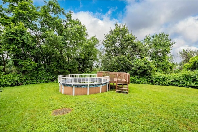 1810 Fairland St, Carrick, PA 15210 - view of grassy yard featuring a wooden deck and a covered pool