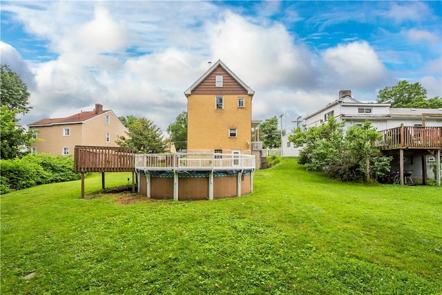 1810 Fairland St, Carrick, PA 15210 - view of green lawn with a deck and a covered pool