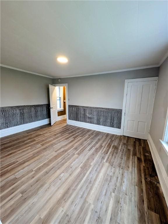 1837 Beech St, Mckeesport, PA 15132 - unfurnished room with wood finished floors, crown molding, and wainscoting