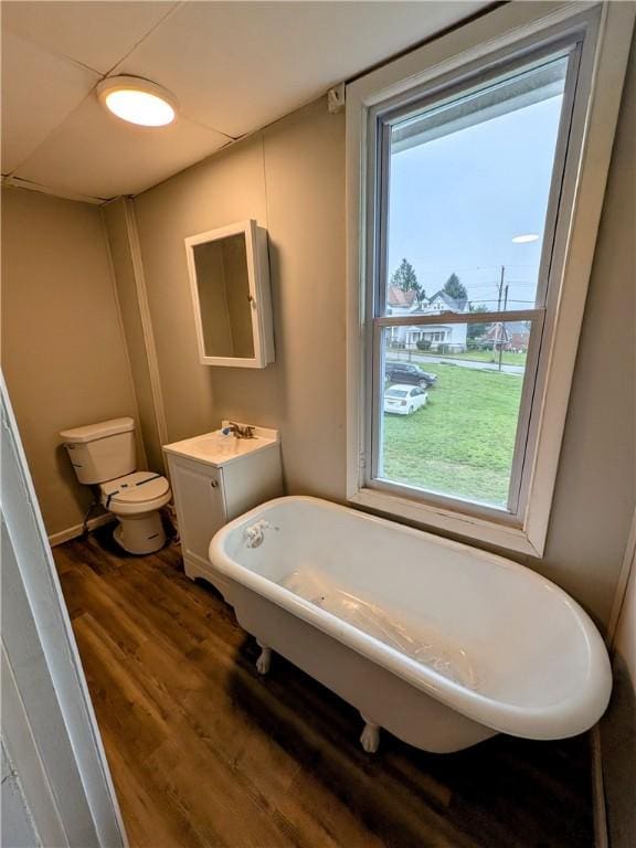 1837 Beech St, Mckeesport, PA 15132 - bathroom featuring a freestanding tub, vanity, and wood finished floors