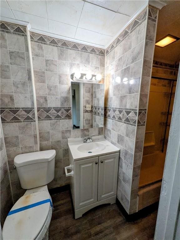 1837 Beech St, Mckeesport, PA 15132 - bathroom with vanity, wood finished floors, and tile walls