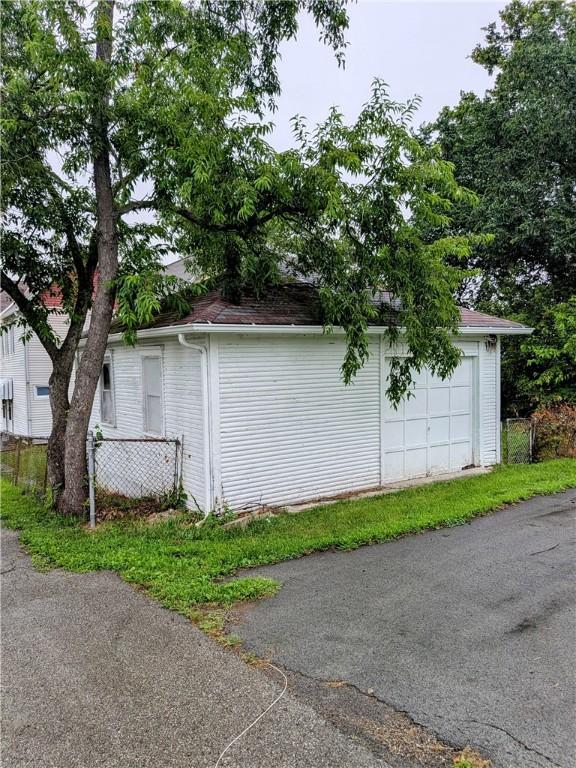 1837 Beech St, Mckeesport, PA 15132 - view of side of home featuring a detached garage and an outbuilding