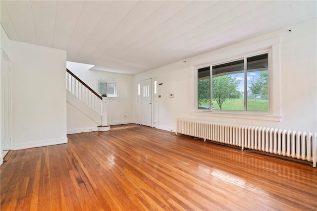 3001 Mount Allister Rd, Observatory Hill, PA 15214 - foyer entrance featuring radiator heating unit, stairway, and wood-type flooring