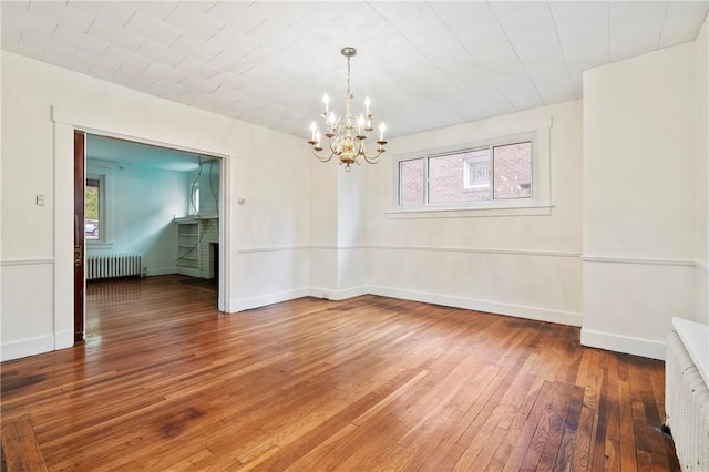 3001 Mount Allister Rd, Observatory Hill, PA 15214 - empty room featuring radiator heating unit, hardwood / wood-style floors, plenty of natural light, and a chandelier
