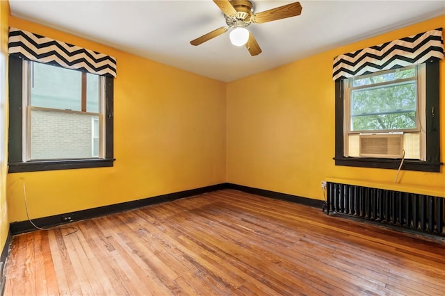 3001 Mount Allister Rd, Observatory Hill, PA 15214 - unfurnished room featuring hardwood / wood-style flooring, radiator heating unit, and a ceiling fan
