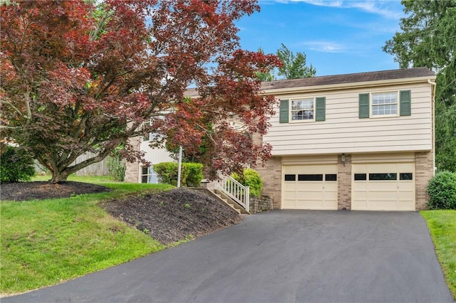 315 Olive St, Mccandless, PA 15237 - view of front of house with asphalt driveway, an attached garage, a front yard, and stairs