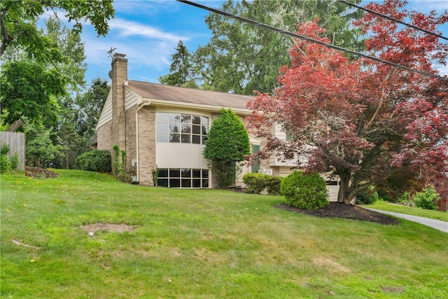 315 Olive St, Mccandless, PA 15237 - view of home's exterior with a chimney, a yard, and brick siding