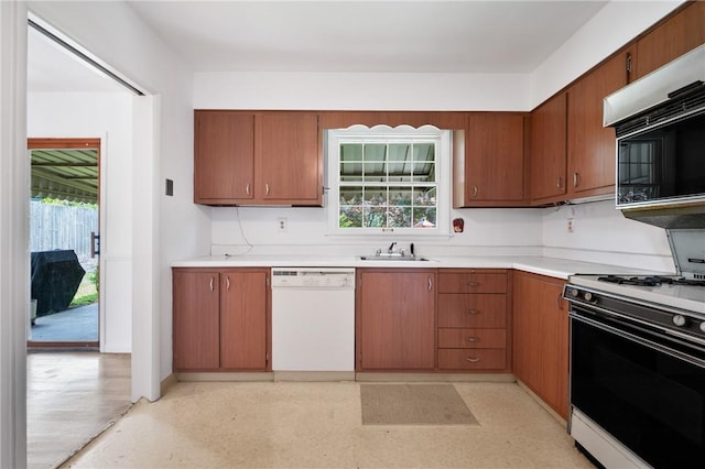 315 Olive St, Mccandless, PA 15237 - kitchen with white dishwasher, gas stove, light countertops, and brown cabinets