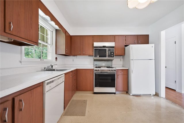 315 Olive St, Mccandless, PA 15237 - kitchen with white appliances, brown cabinets, and light countertops