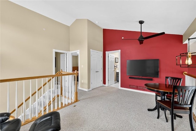 1049 Waterford Ct E, North Strabane, PA 15317 - carpeted living area featuring high vaulted ceiling and a ceiling fan