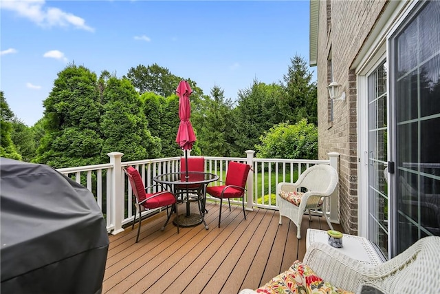 1049 Waterford Ct E, North Strabane, PA 15317 - wooden terrace featuring outdoor dining space, a grill, and view of scattered trees