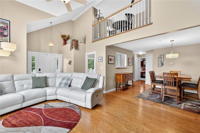 1049 Waterford Ct E, North Strabane, PA 15317 - living room with light wood-type flooring, high vaulted ceiling, and a ceiling fan
