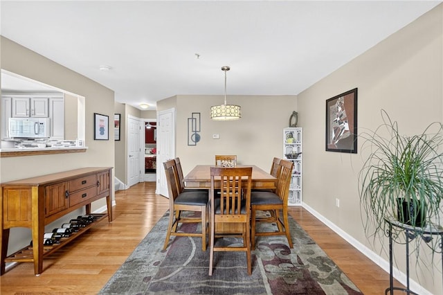 1049 Waterford Ct E, North Strabane, PA 15317 - dining room featuring light wood-style floors and baseboards