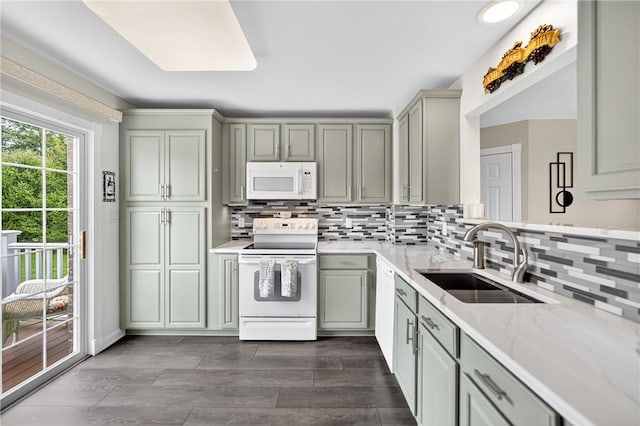 1049 Waterford Ct E, North Strabane, PA 15317 - kitchen featuring white appliances, gray cabinetry, and backsplash