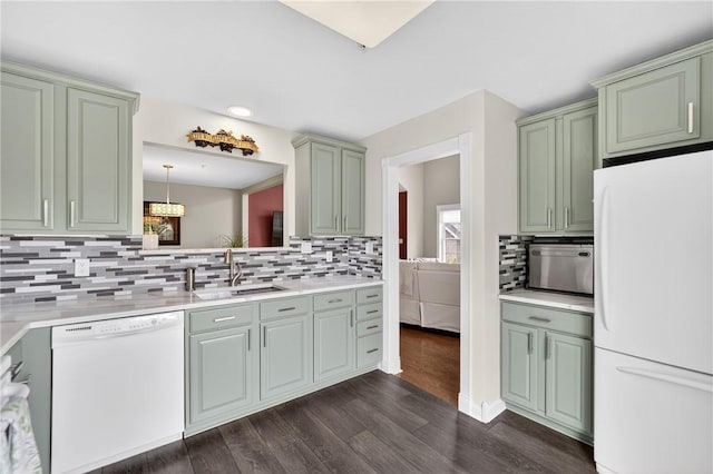 1049 Waterford Ct E, North Strabane, PA 15317 - kitchen with white appliances, dark wood-style flooring, light countertops, backsplash, and green cabinetry