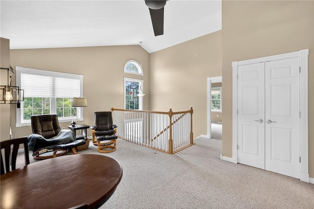 1049 Waterford Ct E, North Strabane, PA 15317 - living area with carpet floors, an upstairs landing, high vaulted ceiling, and ceiling fan