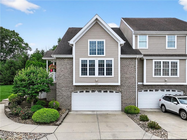 1049 Waterford Ct E, North Strabane, PA 15317 - view of front of property featuring a garage, driveway, and brick siding