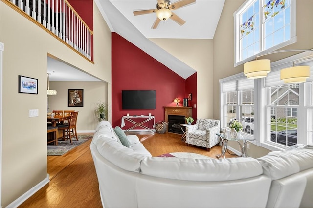 1049 Waterford Ct E, North Strabane, PA 15317 - living room with high vaulted ceiling, ceiling fan, and wood finished floors