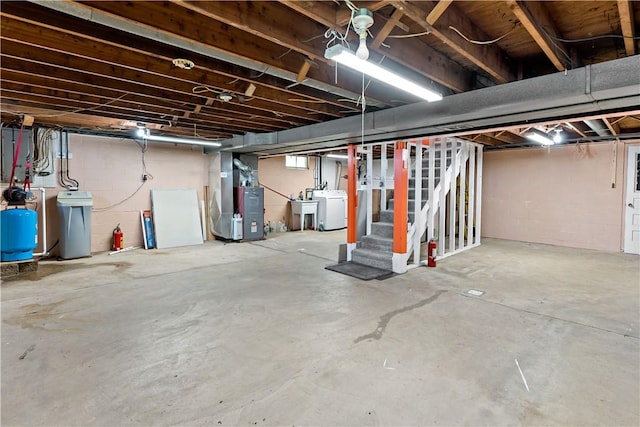 5342 Pleasant Unity Rd, Latrobe, PA 15650 - unfinished basement with washer / clothes dryer, heating unit, stairs, a water softener system, and a water pressure tank